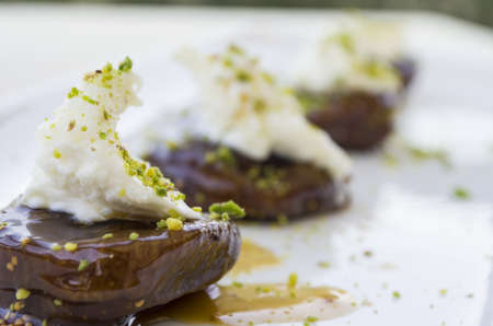 sweet fig with cream on white plate