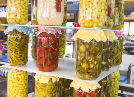 jars with variety of pickled vegetables preserved food