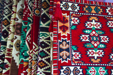 pile of turkish kilims as a colorful background handmade woven rugs and tapestry vintage carpets