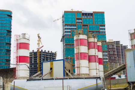 concrete mixing plants on construction and crane background