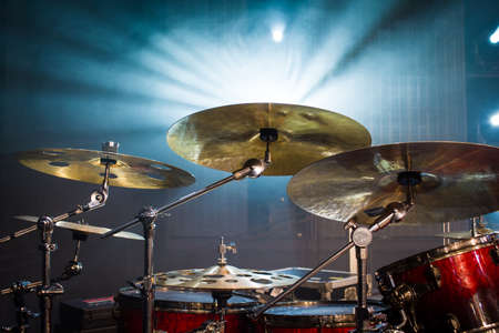 drum set on stage and light background; empty stage with instruments ready for performanceの写真素材