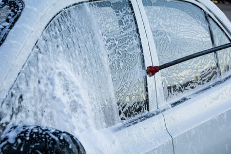 cleaning the car with foam car wash shopの写真素材