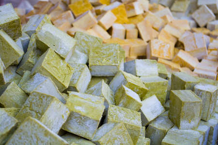 columns and rows of various colorful homemade bar soapsの写真素材