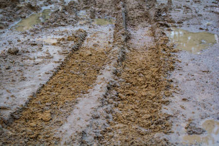 wheel tracks on rough roadの写真素材