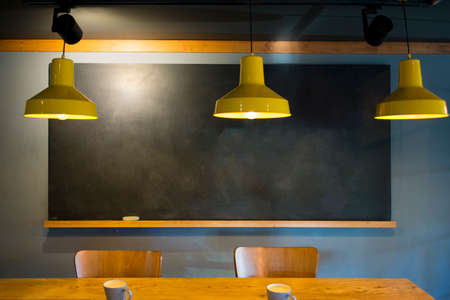 warm coffee cup set on wooden floor table desk filled with hot espresso, tea shownの写真素材