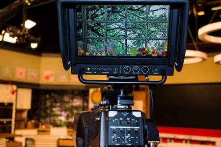 Video camera - recording show in TV studio - focus on camera