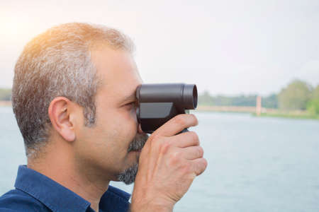 Man with old vintage camera in hands.