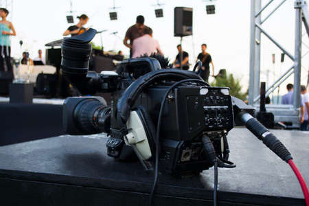 Professional digital video camera. accessories for 4k video cameras. tv camera in a concert hall.の写真素材