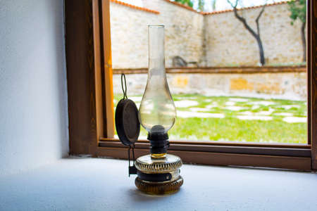 lantern lamp light in wooden window in dayの写真素材
