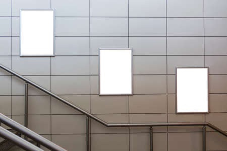 Three big vertical / portrait orientation blank billboard with stairs background