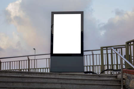 One big vertical / portrait orientation blank billboard in city street