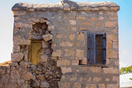 Landscape with ruins of old house against blue sky. Historical place, remains of the stone house where one of the first settlers lived in Turkeyの写真素材
