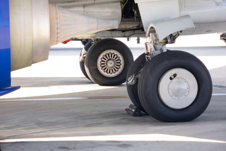 Close up of aircraft wheel at the hangarの写真素材