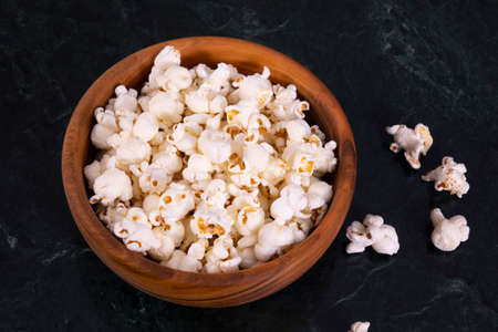 Salt popcorn on the marble table, selective focusの写真素材