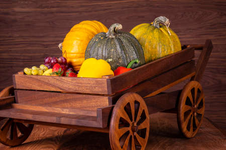 Fruits and vegetables with pumpkins in autumn still life