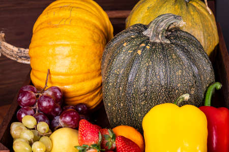 Fruits and vegetables with pumpkins in autumn still lifeの写真素材