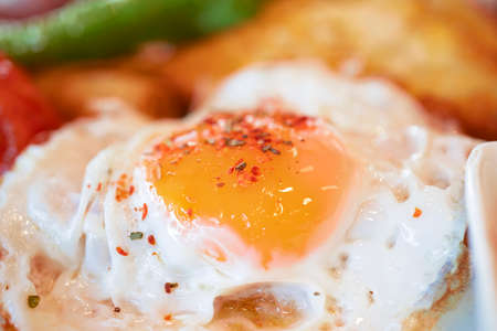 Photo of fried eggs close up, breakfast