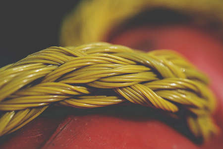 Yellow plastic rope on blur backgroundの写真素材