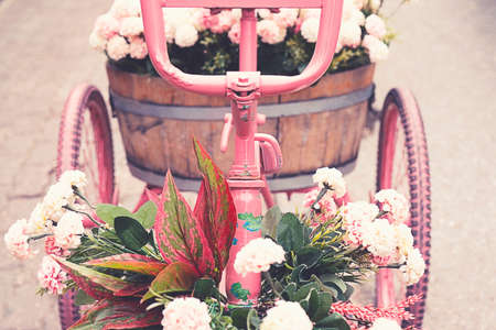 Wedding ceremony vintage retro decor. Metal pink bike with flowersの写真素材