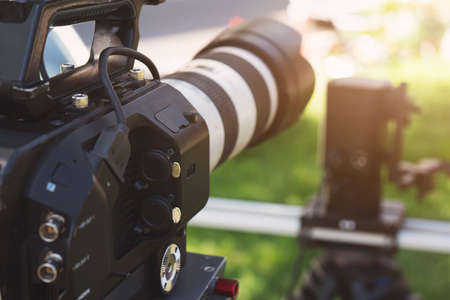 Super close up of Professional Video Camera. The Focus is on the lens and the front partの写真素材