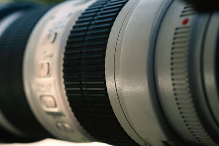 Camera lens on light background
