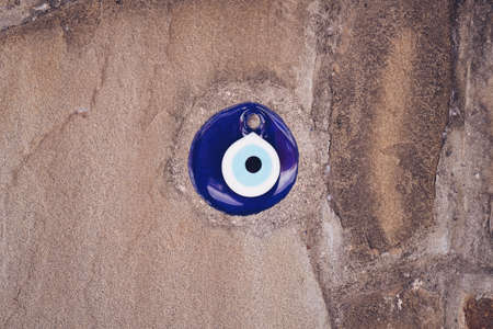 glass turkish eye on stone backgroundの写真素材
