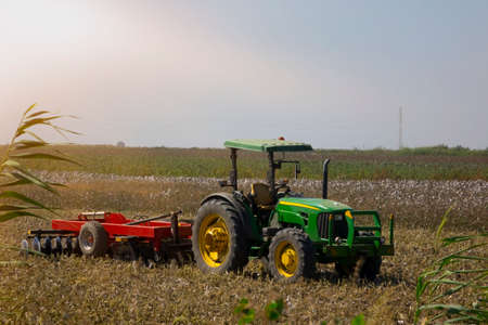 cotton field after harvest with a tractor.のeditorial素材