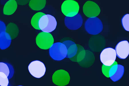 Blue, green, magenta and white Festive Christmas elegant abstract background with bokeh lightsの写真素材