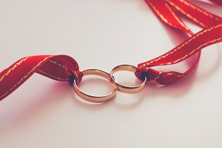 Little girl's rubber slippers on the beach at sunriseの写真素材