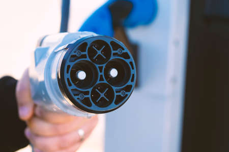 Power plug of electric car. Car industry