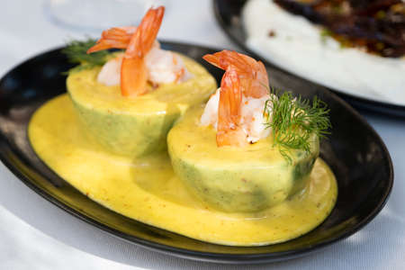 Elegantly presented shrimp dinner on a luxury restaurant tableの写真素材