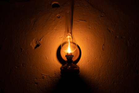 Kerosene lamp hanging on an old wall.の写真素材