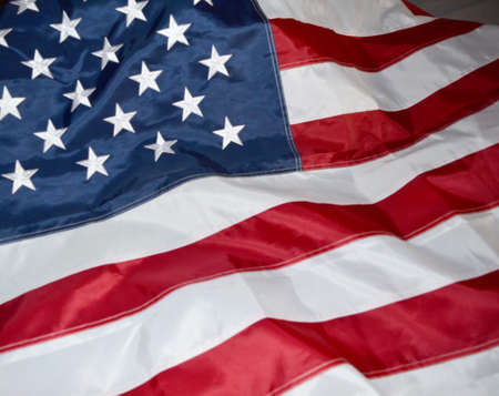 USA flag, close-up. Studio shot. USA flag background. Stars displaying on waving American flag in...