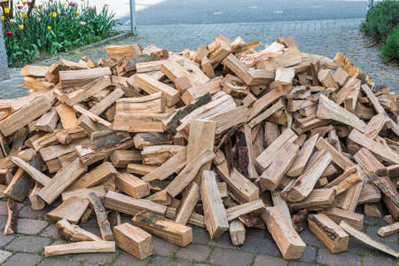 Messy pile of firewood on a drive, delivered for the winter stockの写真素材