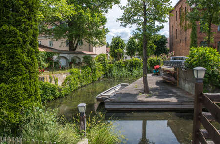 Houses at a water canal in Luebbenau, biosphere reserve spree forest (Spreewald), Germanyの写真素材