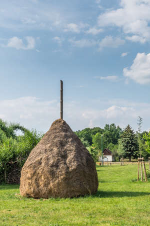 Haystack on a meadow, typical in spree forest, Germany, state Brandenburgの写真素材