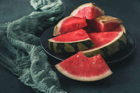Pieces of watermelon on green background