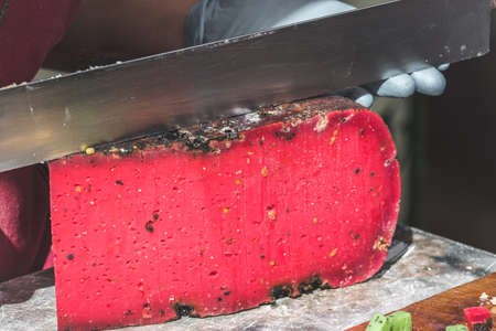 Piece of a french red tomato cheese at a market standの写真素材