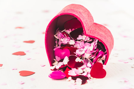 Heart shaped little box with little red, pink and white hearts for decorationの写真素材