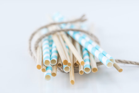 Eco tubules for drinks, straw and paper drinking straws on white background, isolated, copy space, concept of sustainability and no plastic.の写真素材