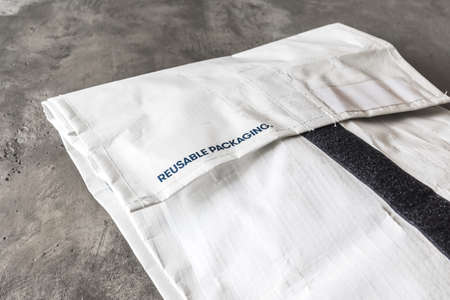 Reusable bag used by online shops for shipping. Postage for sending it back is paid by the shop....