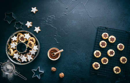Top view on a christmas cookies baking scene, dark gray backgroundの写真素材