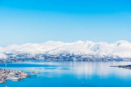 View from Mount Storsteinen on the Norwegian mountains around the city of Tromso, copy space