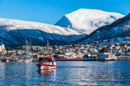 Tromso, Norway, March 6th 2022: View to the Tromso urban neighborhood Tromsdalen, in the foreground...