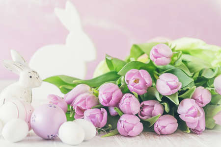 Bunch of fresh pink tulips with Easter decorations, pink, green and white colorsの写真素材