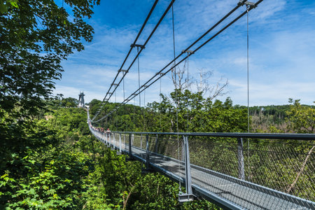 Wendefurth, Germany - 06/17/22: Titan RT rope suspension bridge over the Rappbodetalsperre in the Harz Mountains in Germany.のeditorial素材