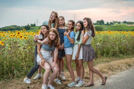 Teenage girls take a selfie in summerの写真素材