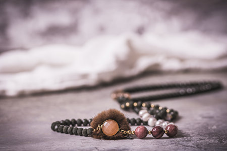 Necklace with pearls, costume jewelry on gray background, vintage styleの写真素材