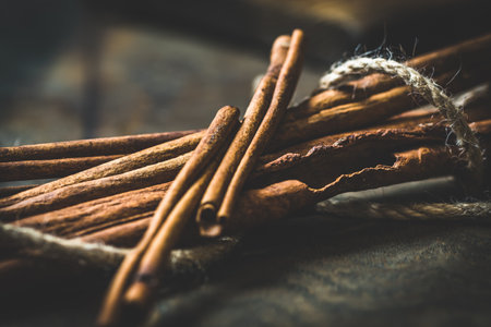 Cinnamon sticks on rustic dark background, selective focusの写真素材
