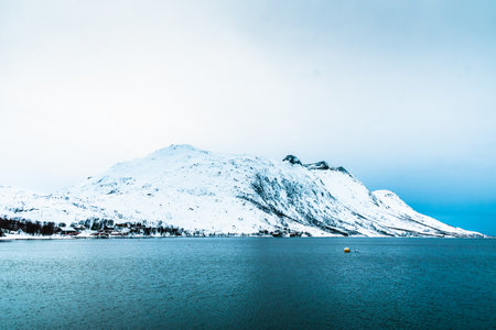 Ersfjorden in Troms, Norway, in winter. Ersfjorden is a fjord in the Tromso municipality of Norway. It is 12.5 kilometers long and begins on the western side of Kvaloya.の写真素材